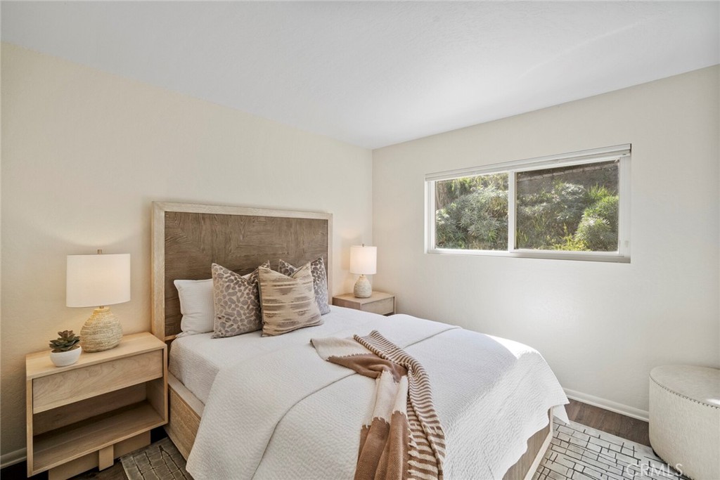 32321 Azores Road Dana Point, CA 92629 - Photo 18 of 46 a bedroom with a bed and a lamp on dresser