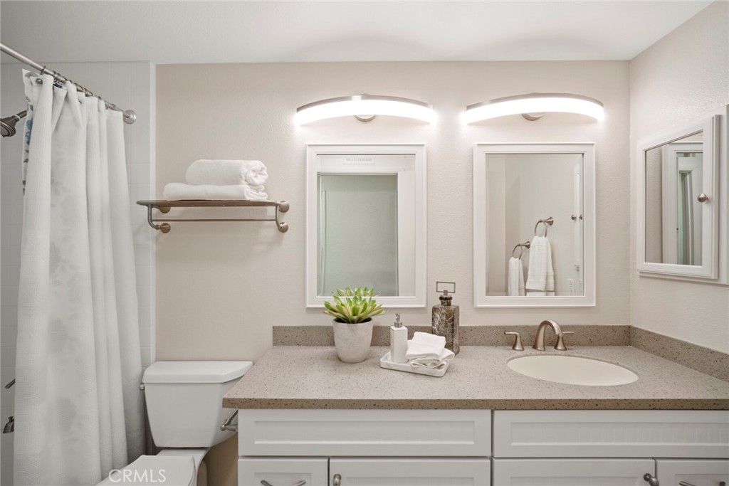 32321 Azores Road Dana Point, CA 92629 - Photo 20 of 46 a bathroom with a granite countertop shower sink and toilet