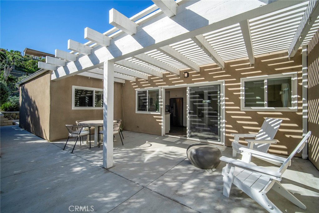 32321 Azores Road Dana Point, CA 92629 - Photo 23 of 46 a view of a porch with chairs and potted plants