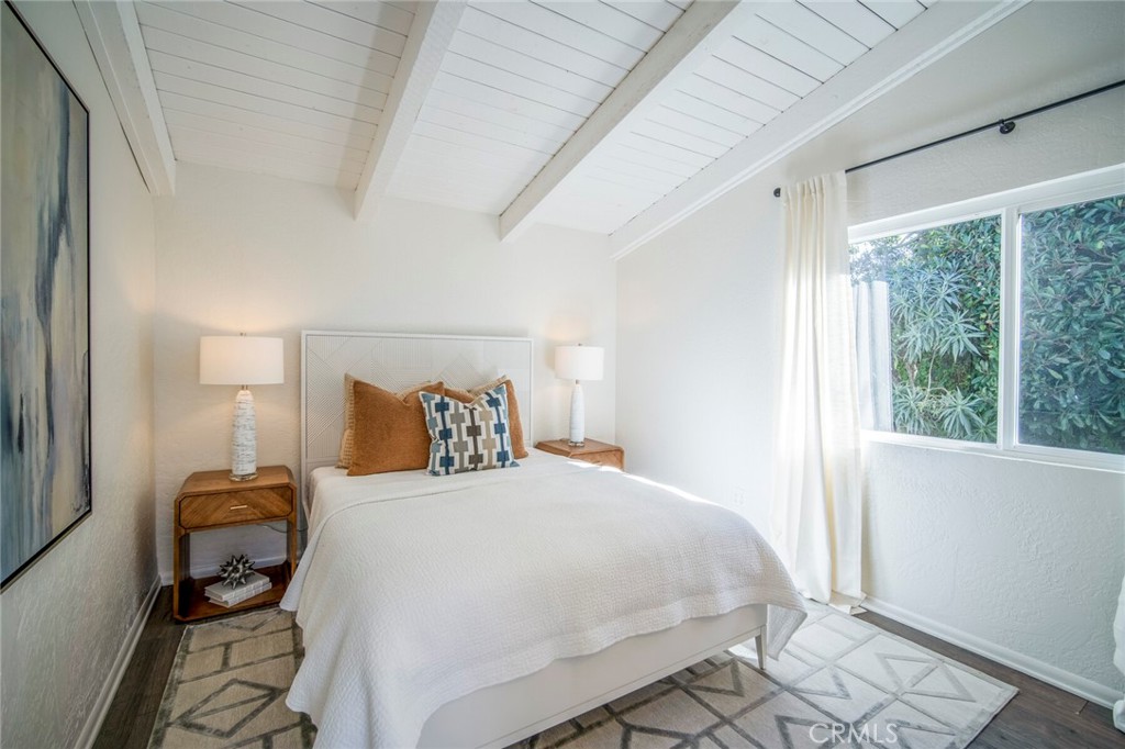 32321 Azores Road Dana Point, CA 92629 - Photo 25 of 46 a bedroom with a bed and wooden floor