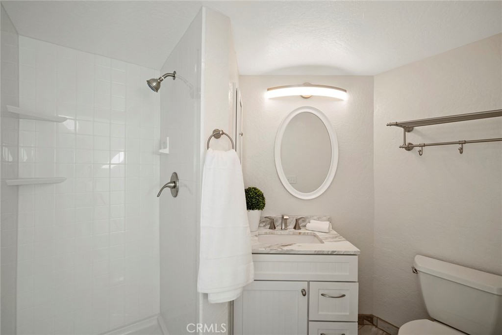 32321 Azores Road Dana Point, CA 92629 - Photo 26 of 46 a bathroom with a sink a toilet and a mirror