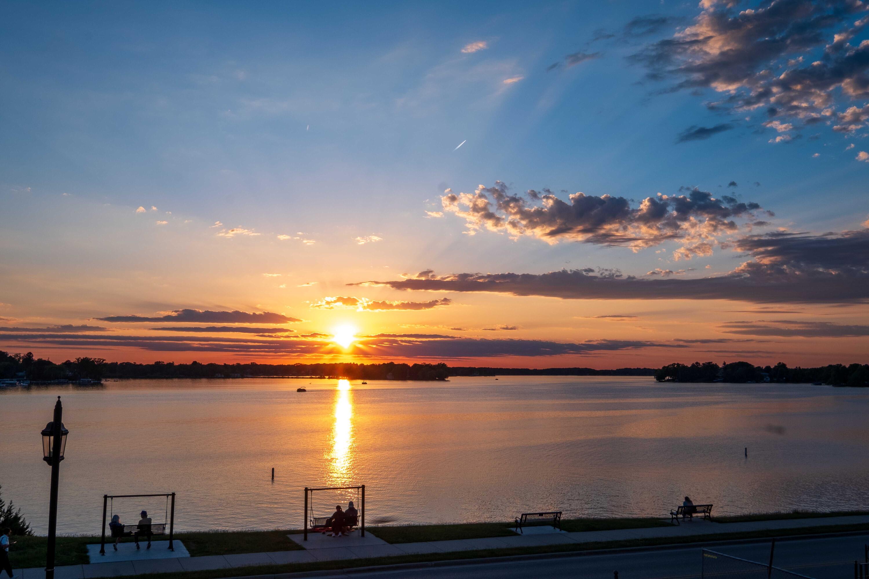 503 North Lake Road, Unit 1 Oconomowoc, WI 53066 - Photo 22 of 23 Daily Sunsets & Sunrises Over Water