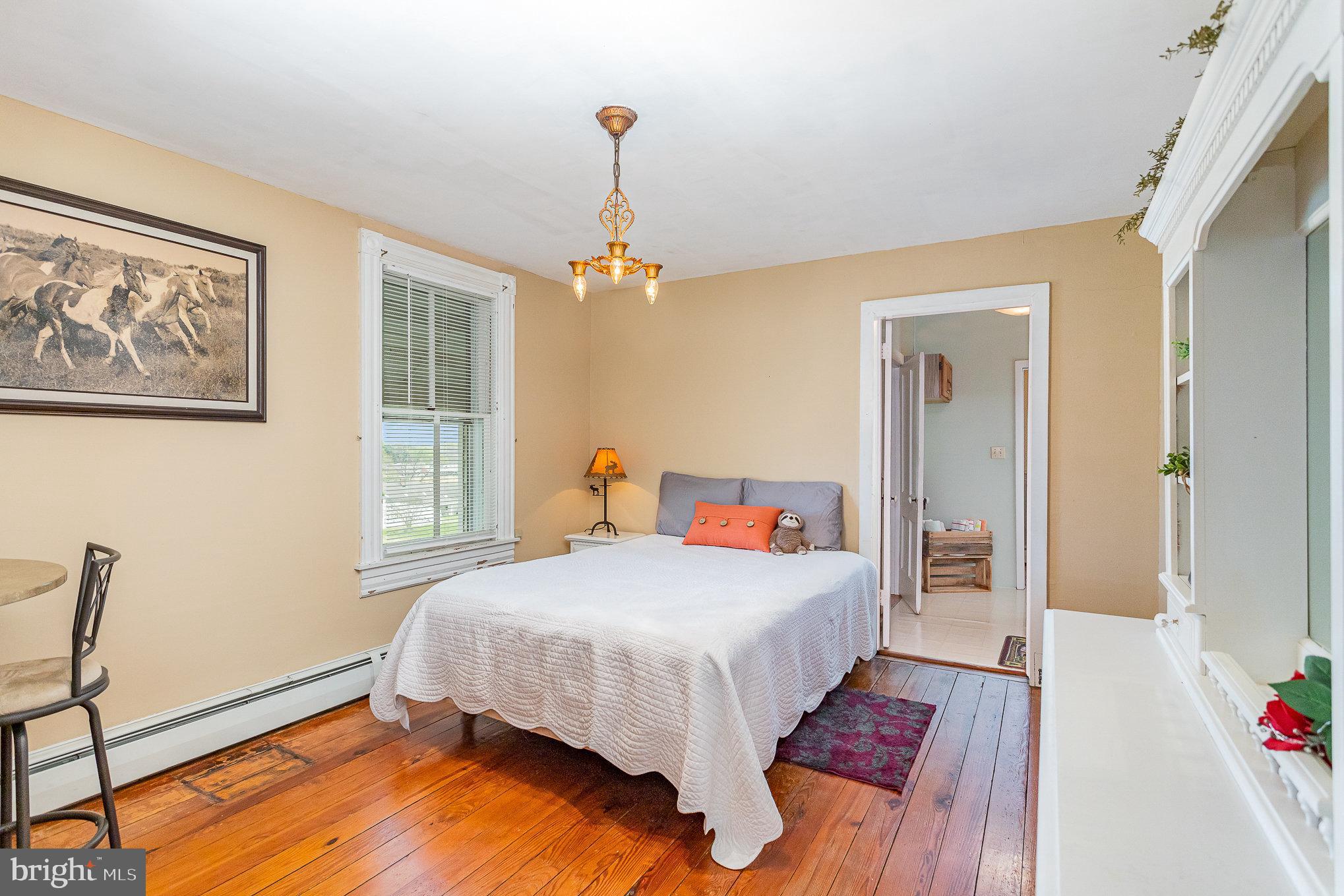 377 Pilottown Road Peach Bottom, PA 17563 - Photo 23 of 50 a bedroom with a bed and wooden floor