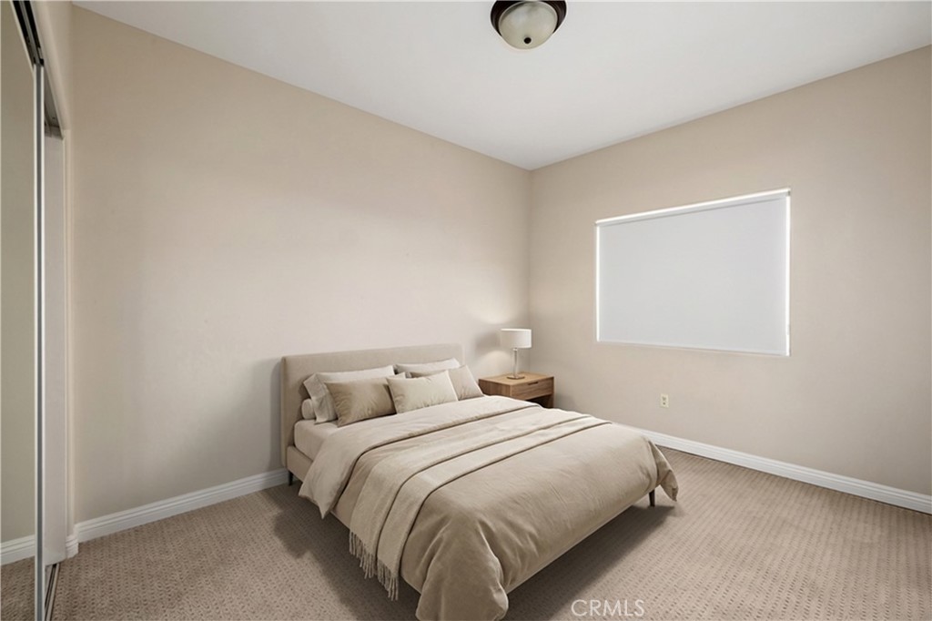 14535 Margate Street, Unit 13 Sherman Oaks, CA 91411 - Photo 13 of 22 a bedroom with a bed and window