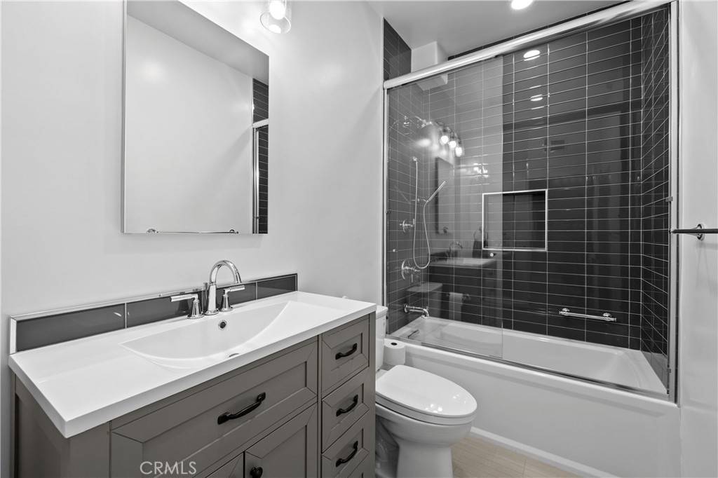 14535 Margate Street, Unit 13 Sherman Oaks, CA 91411 - Photo 14 of 22 a bathroom with a sink a toilet and shower