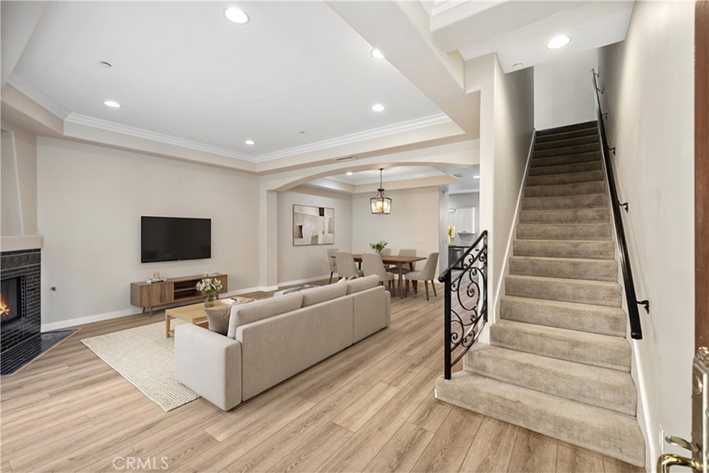 14535 Margate Street, Unit 13 Sherman Oaks, CA 91411 - Photo 7 of 22 a living room with furniture and a flat screen tv