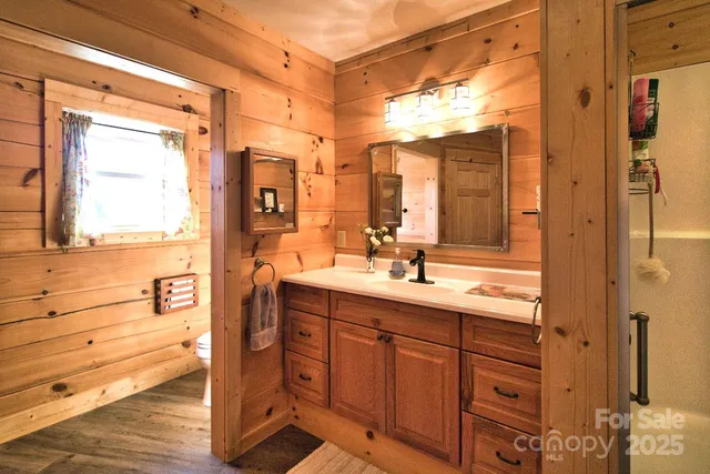 a bathroom with a double vanity sink mirror and