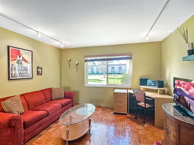 a living room with furniture and a window