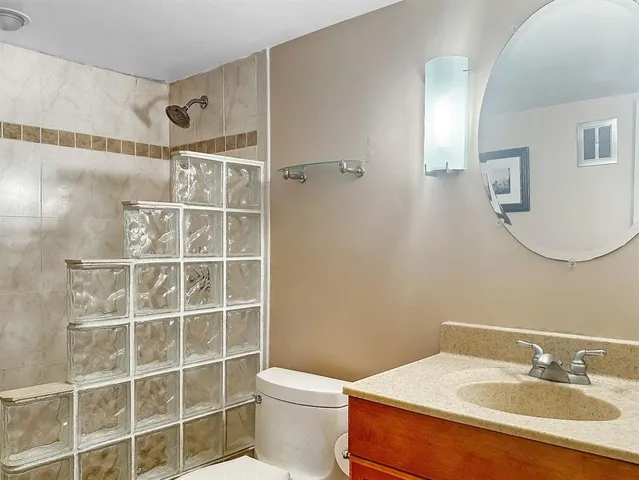 an aerial view of a house with a swimming pool and outdoor seating