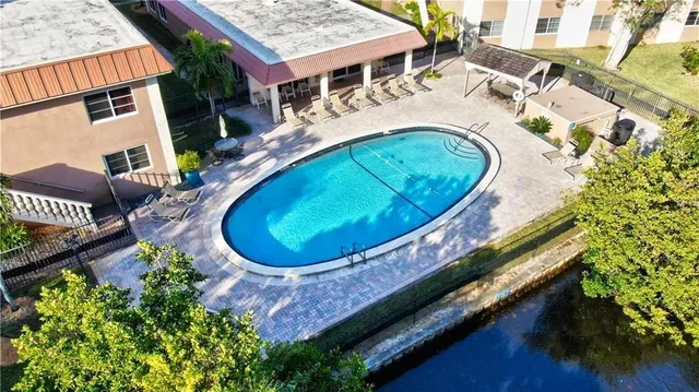 a view of grassy field with trees