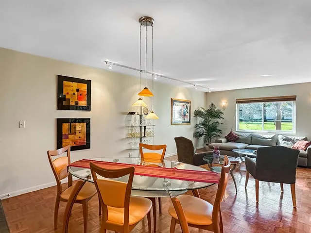 a bedroom with a bed and a night stand