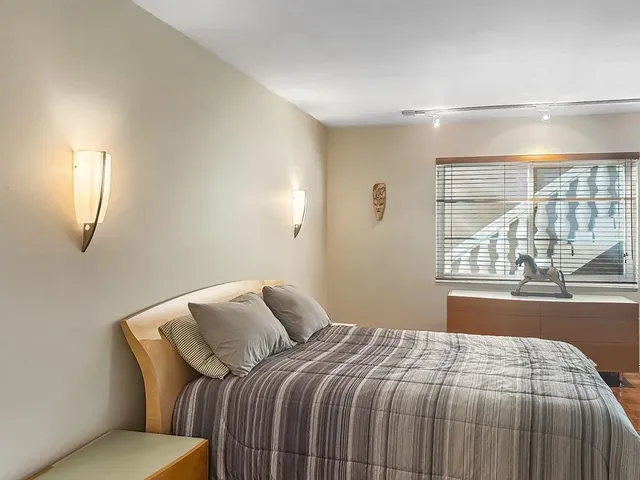 a kitchen with refrigerator and cabinets