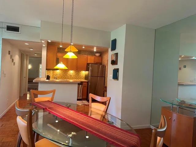 a blue couch sitting in a blue painted bathroom next to a blue wall