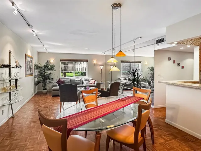 an aerial view of a house with a garden and lake view