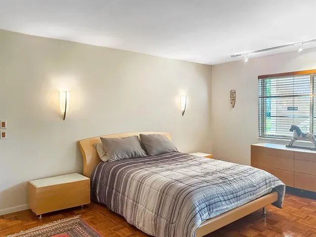a blue painted room with a couch and a table