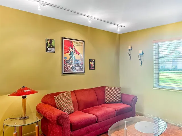 a living room with furniture and a table