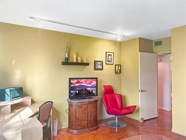 a dining room with furniture and a chandelier