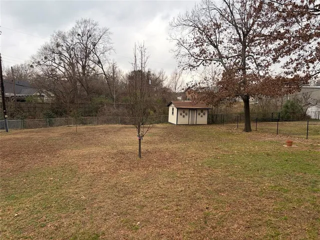 a view of a house with pool and chairs