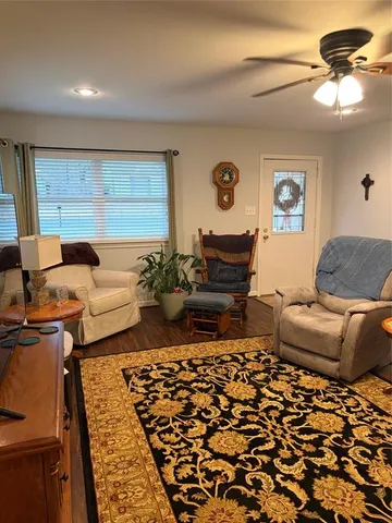 a living room with furniture and a rug