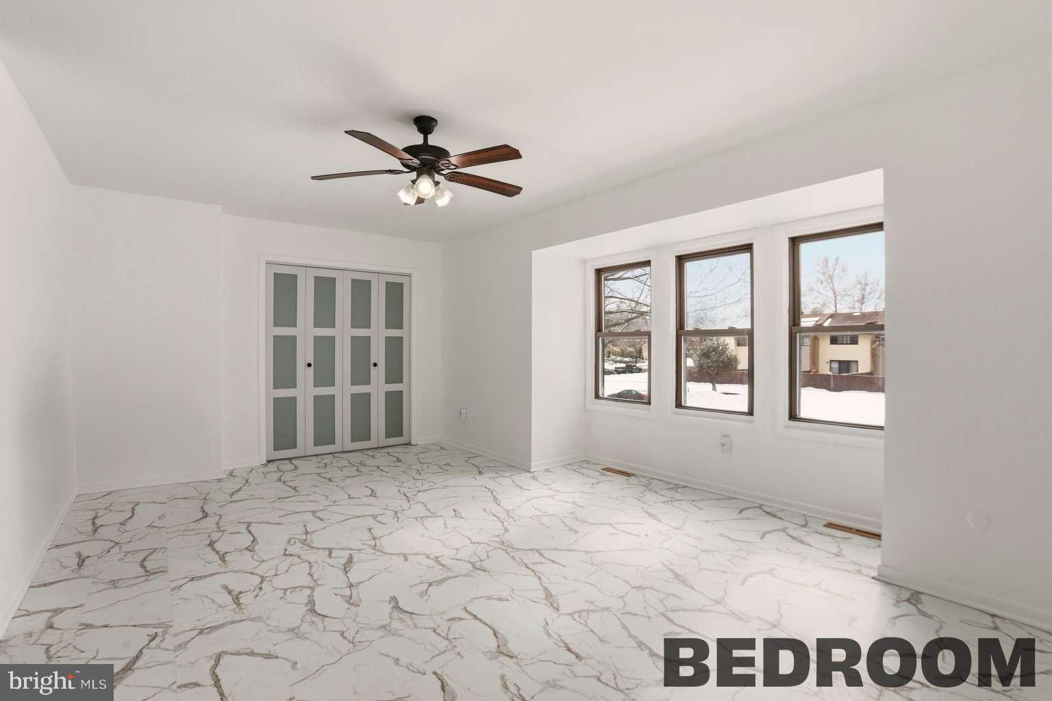 960 Jamestown Road Hightstown, NJ 08520 - Photo 8 of 18 a view of an empty room with a window