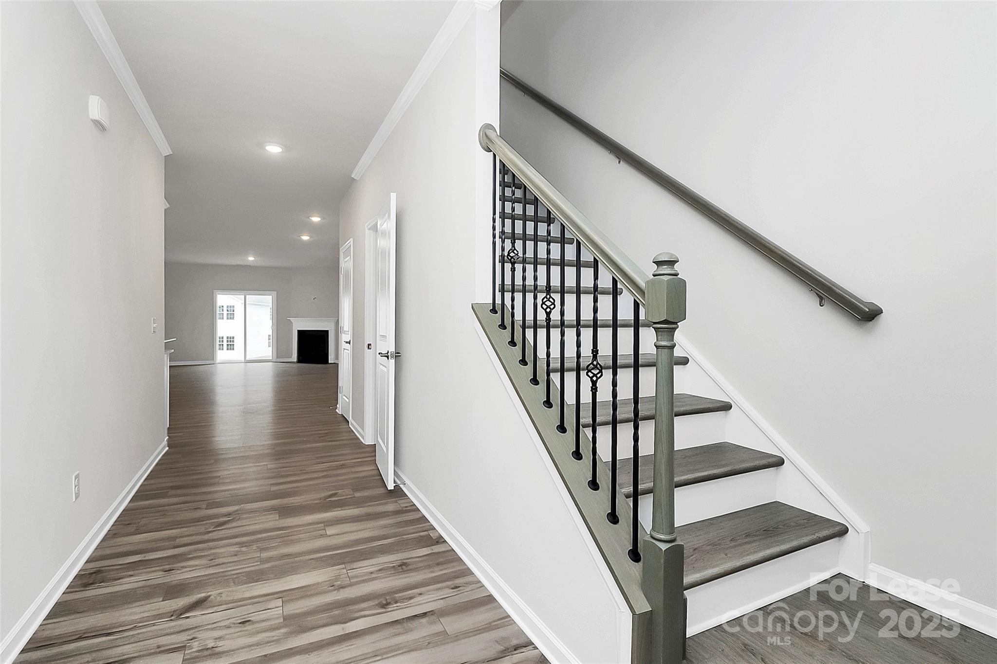 1617 Swallow Tail Drive Belmont, NC 28012 - Photo 2 of 18 a view of staircase with wooden floor and white walls