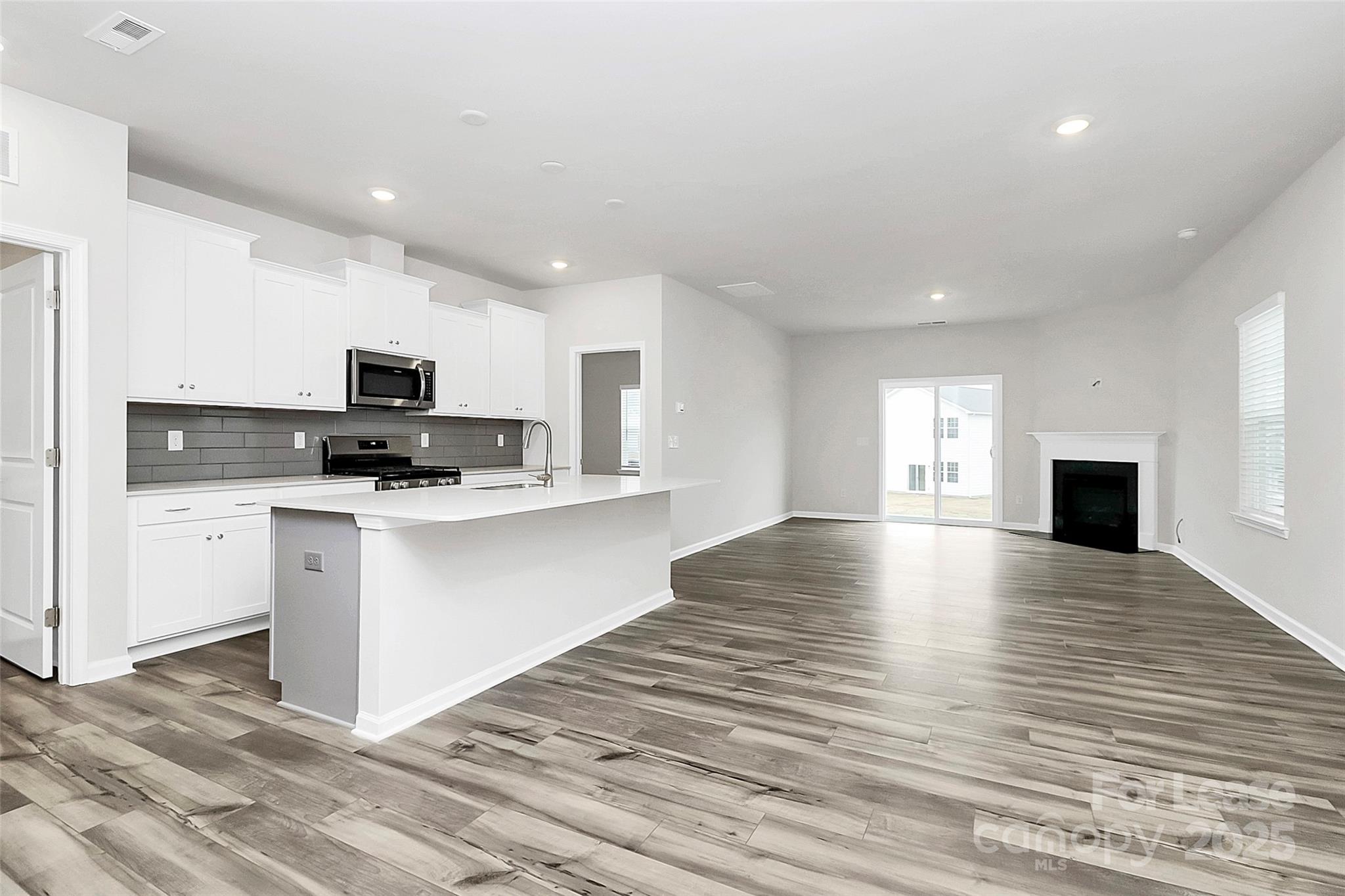 1617 Swallow Tail Drive Belmont, NC 28012 - Photo 3 of 18 a view of kitchen with microwave stove refrigerator and cabinets