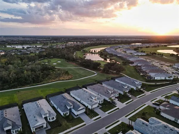 a view of a livingroom with furniture window and wooden floor