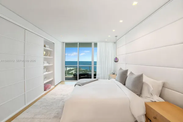 a bed room with a bed and a window
