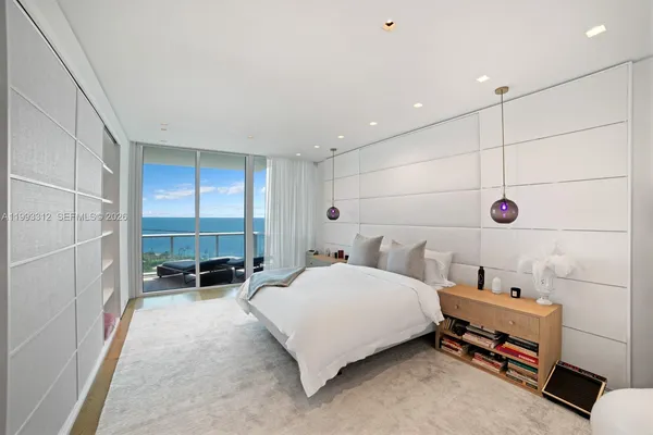 a bedroom with a bed and a table in it