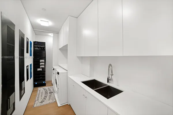 a kitchen with a sink and cabinets