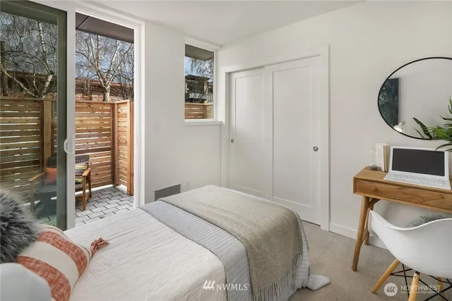 a bedroom with a bed a desk and chair