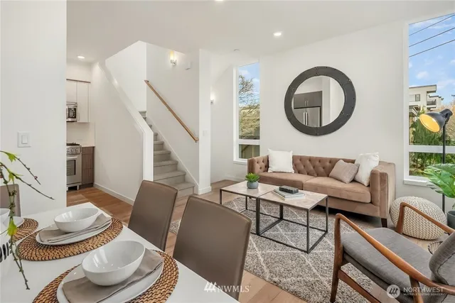 a living room with furniture and a mirror