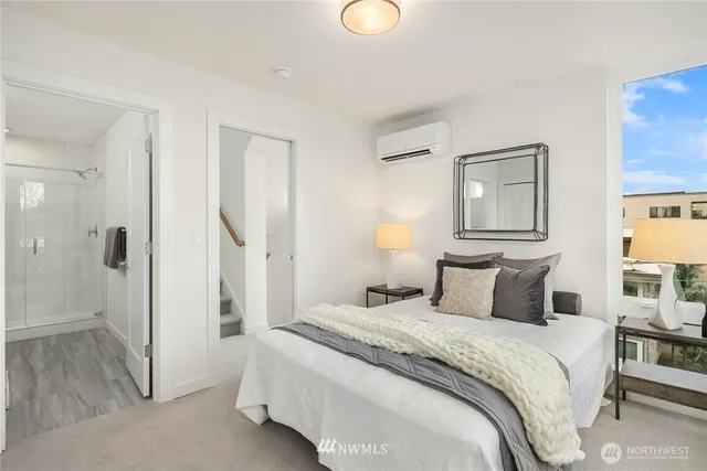 a bedroom with a bed and a lamp