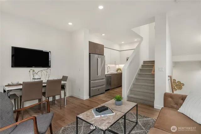 a view of a livingroom with furniture and a flat screen tv