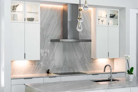 a kitchen with stainless steel appliances granite countertop a sink and refrigerator