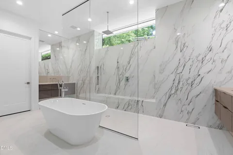 a view of a kitchen with dining room and wooden floor