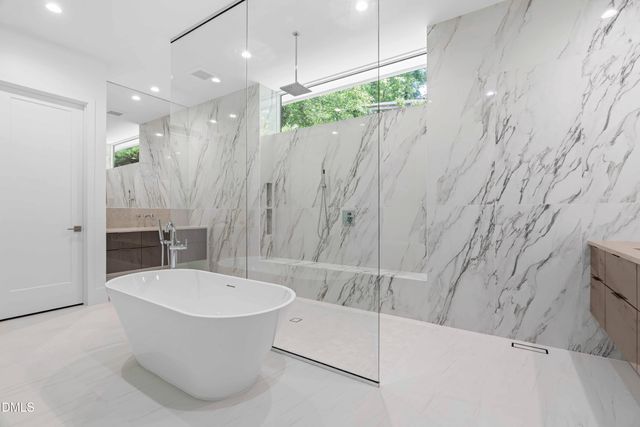 a view of a kitchen with dining room and wooden floor