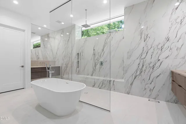 a view of a kitchen with dining room and wooden floor