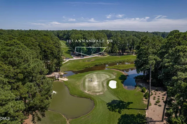 a view of a golf course with a lake