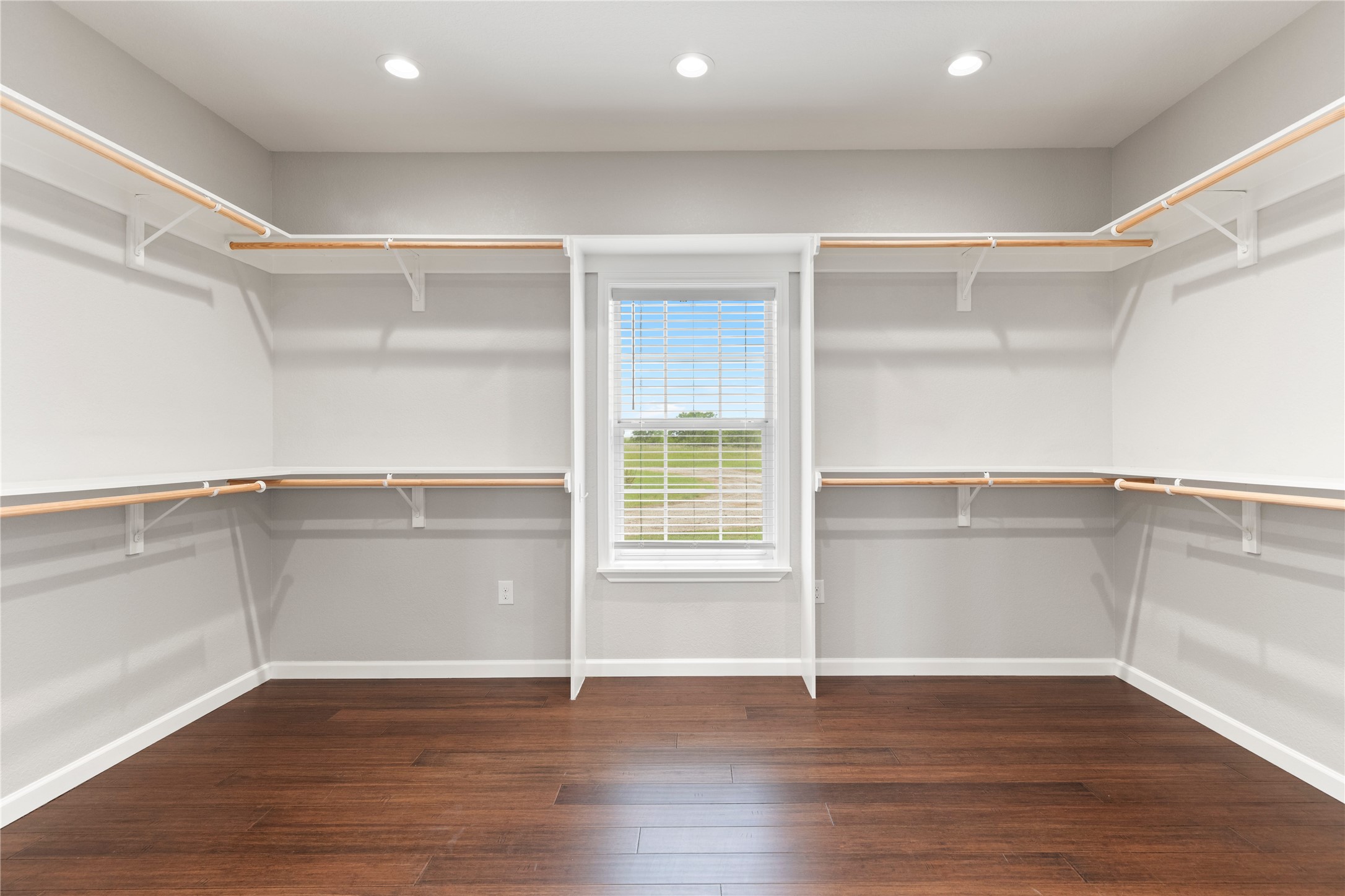 1293 Pioneer Road Seguin, TX 78155 - Photo 19 of 40 Ample closet space with practical shelving and a naturally illuminated interior.