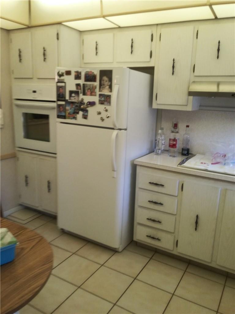601 South State Road 7, Unit 1C Margate, FL 33068 - Photo 2 of 7 a kitchen with cabinets and appliances