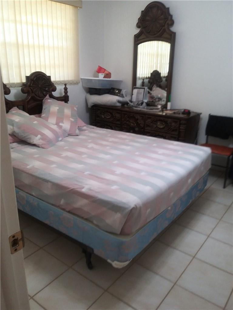 601 South State Road 7, Unit 1C Margate, FL 33068 - Photo 3 of 7 a bedroom with a bed and window