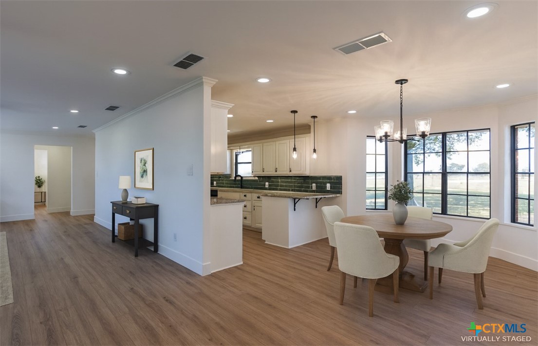 286 South Baese Road Elm Mott, TX 76640 - Photo 5 of 23 a dining room with kitchen island stainless steel appliances furniture and a kitchen view