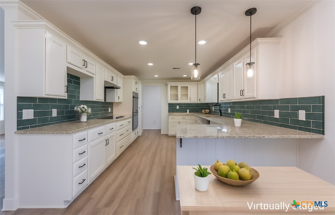 286 South Baese Road Elm Mott, TX 76640 - Photo 8 of 23 a large kitchen with stainless steel appliances lots of counter space and breakfast area