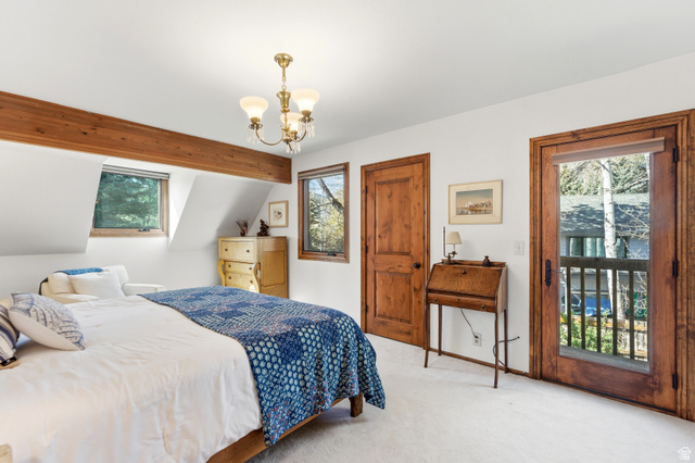 2635 Little Kate Road, Unit 21 Park City, UT 84060 - Photo 22 of 39 Carpeted bedroom with a chandelier and multiple windows