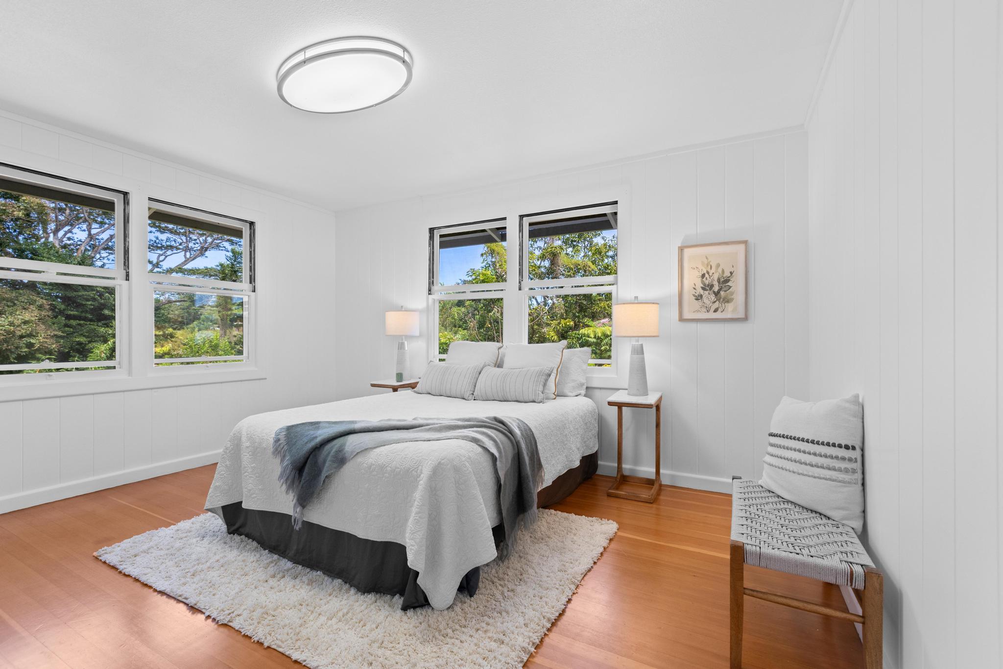 53 Ekaha Street Hilo, HI 96720 - Photo 14 of 29 a bed sitting in a bedroom next to a window