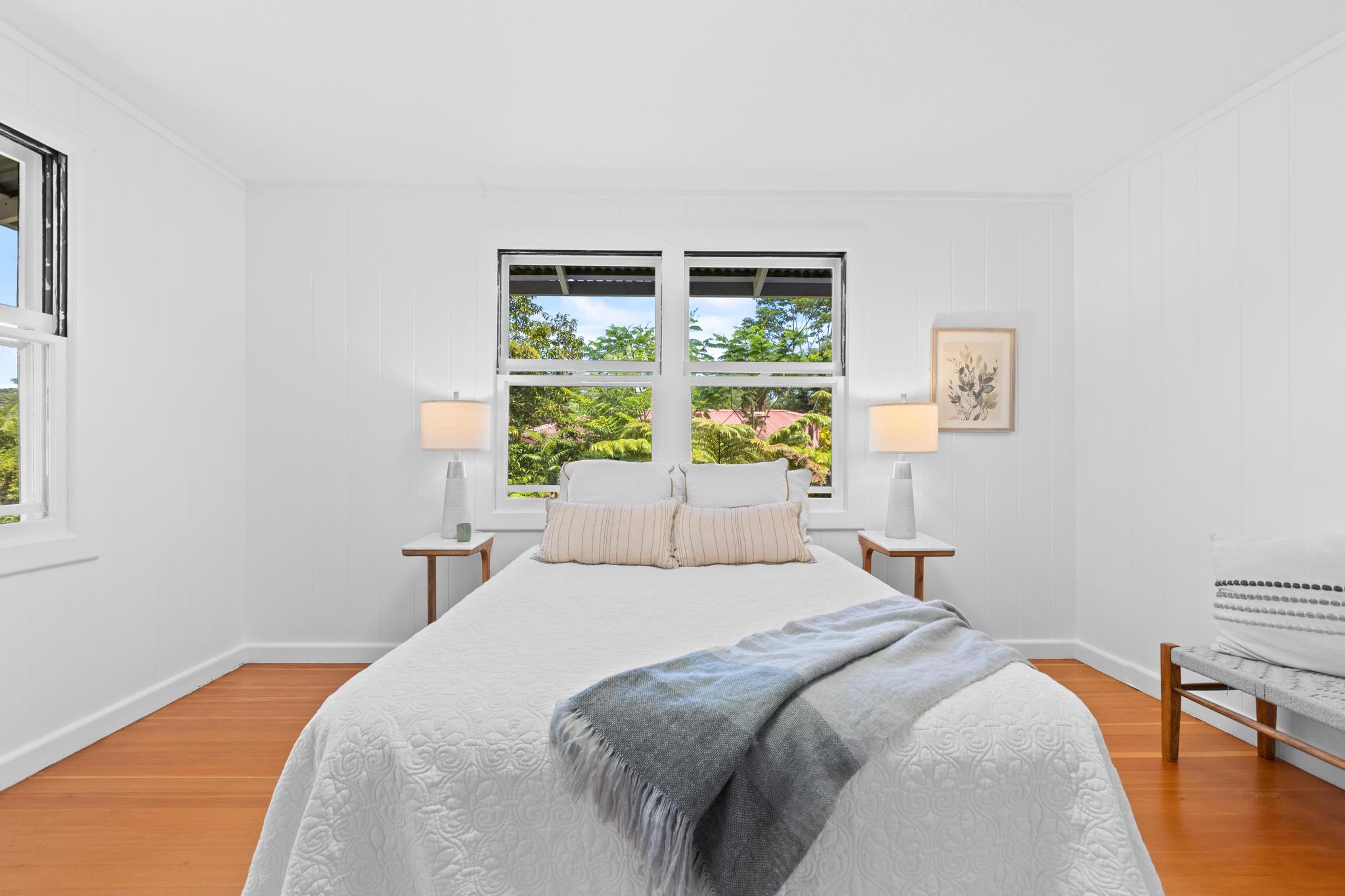 53 Ekaha Street Hilo, HI 96720 - Photo 16 of 29 a bedroom with a bed and a window