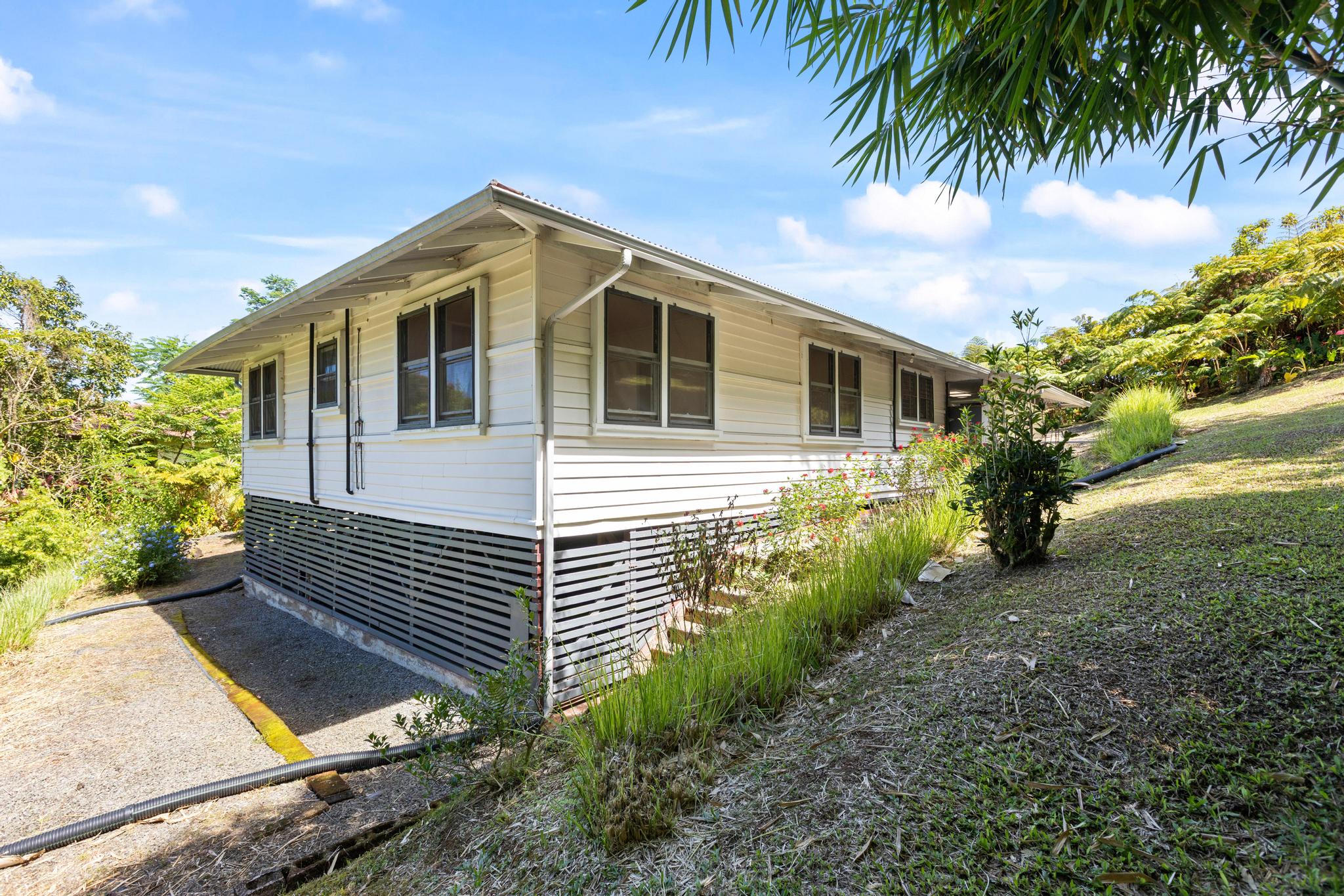 53 Ekaha Street Hilo, HI 96720 - Photo 25 of 29 a view of a house with a yard