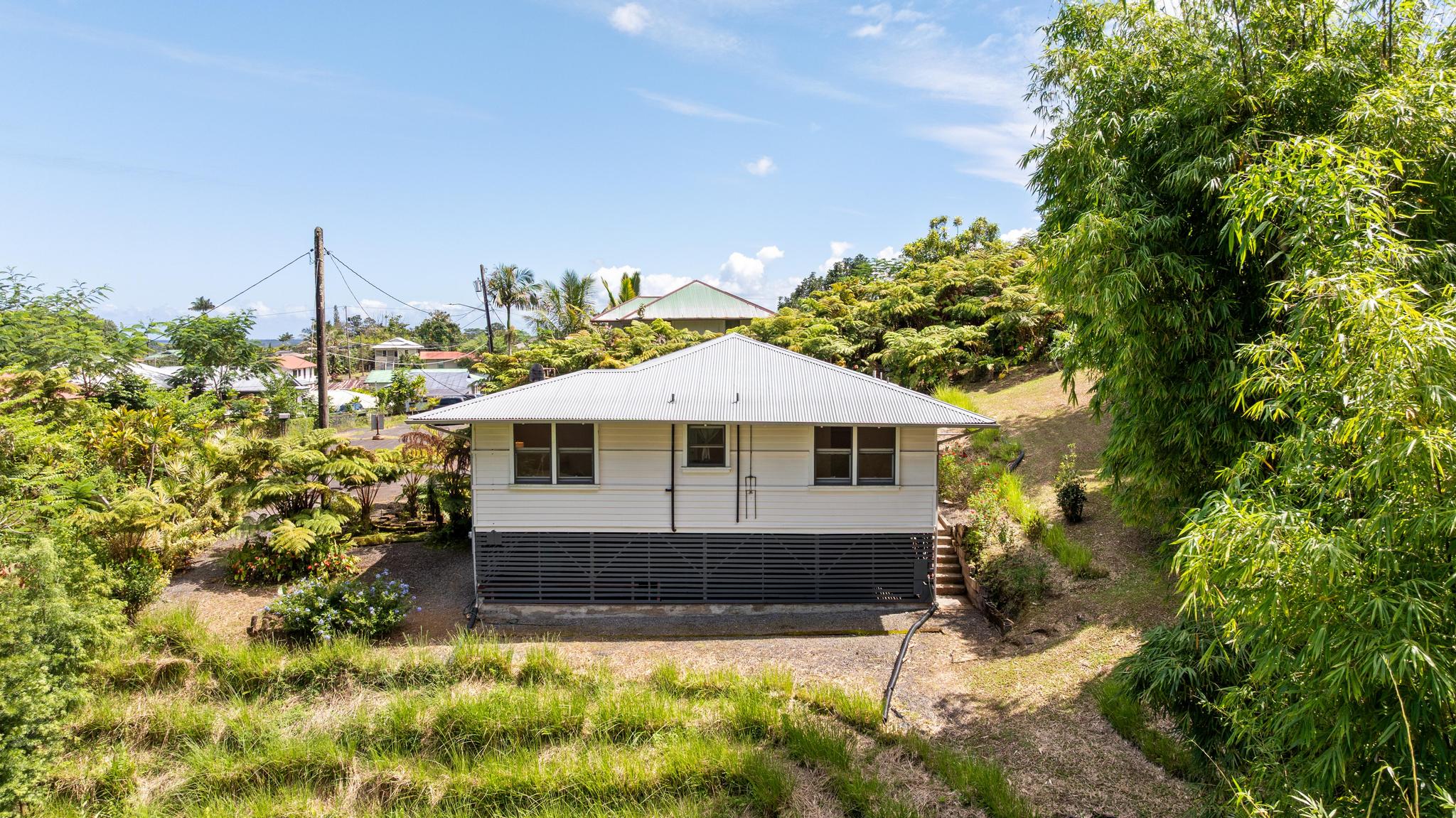 53 Ekaha Street Hilo, HI 96720 - Photo 28 of 29 a front view of a house with a yard