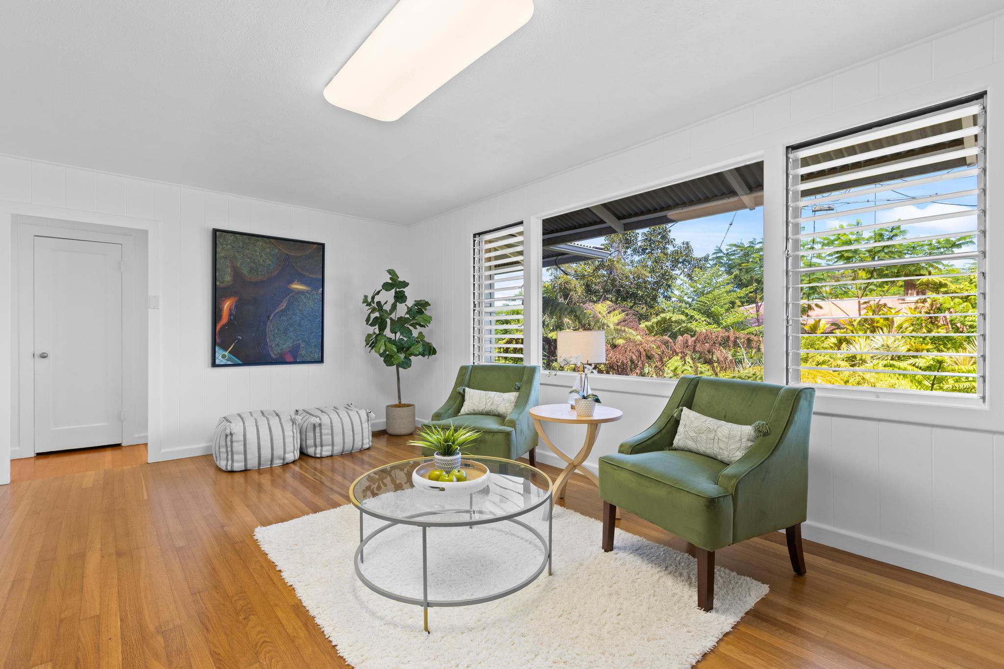 53 Ekaha Street Hilo, HI 96720 - Photo 9 of 29 a living room with furniture and a large window